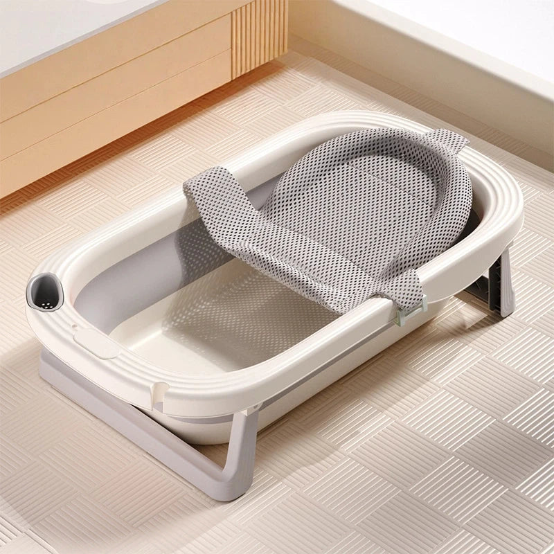 Foldable Baby Bath Tub with temperature sensor from Baby Bubble, showing the compact design and built-in temperature indicator.