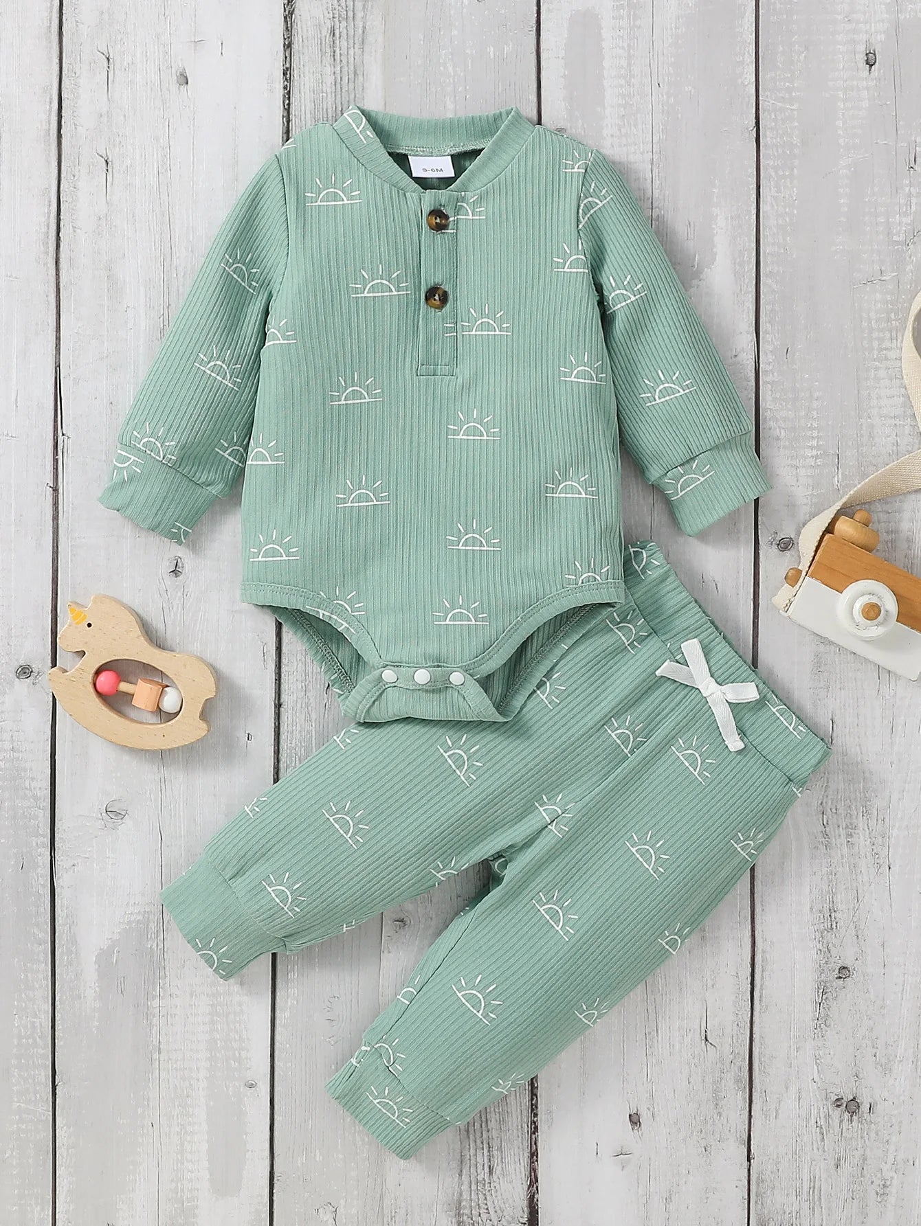 Baby boy 2-piece outfit by Baby Bubble featuring a cute jumpsuit and matching pants, soft and comfortable for little boys.