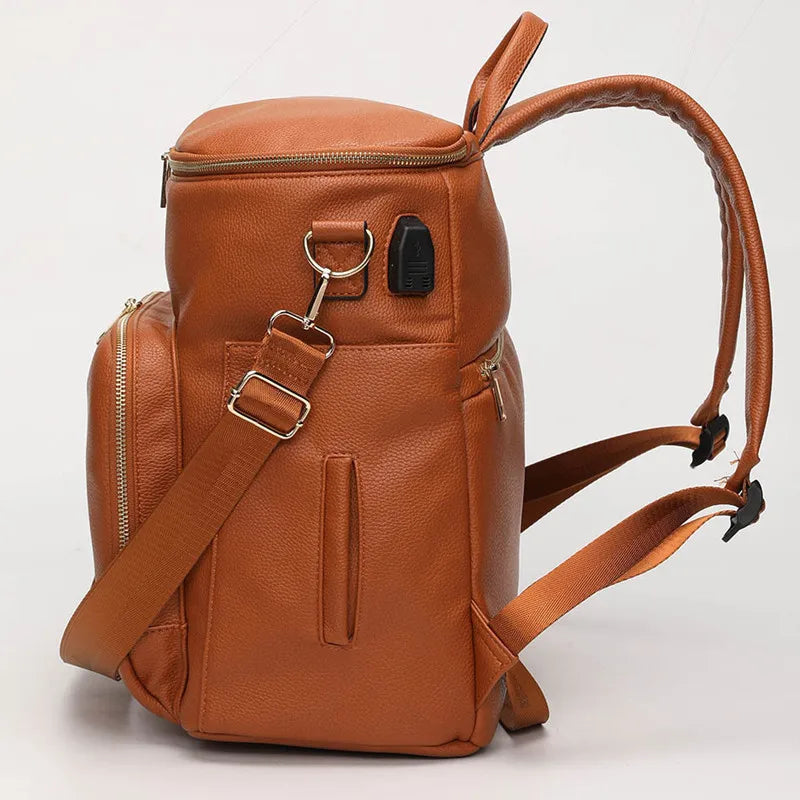 Baby Bubble PU leather diaper bag, travel-ready with multiple compartments and stylish design, perfect for parents on the go.