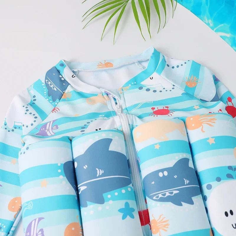 Colorful kids buoyancy swimsuit by Baby Bubble featuring cartoon float design, perfect for safe swimming and water fun.
