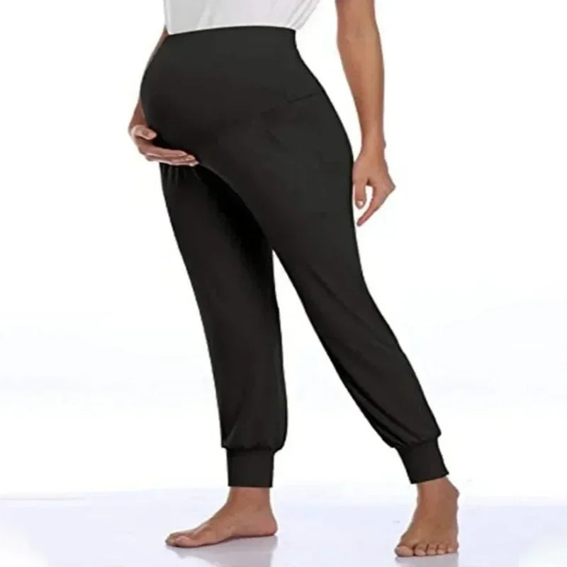 Soft high waist maternity jogger pants from Baby Bubble featuring comfortable, stretchy fabric and relaxed fit for pregnancy comfort.