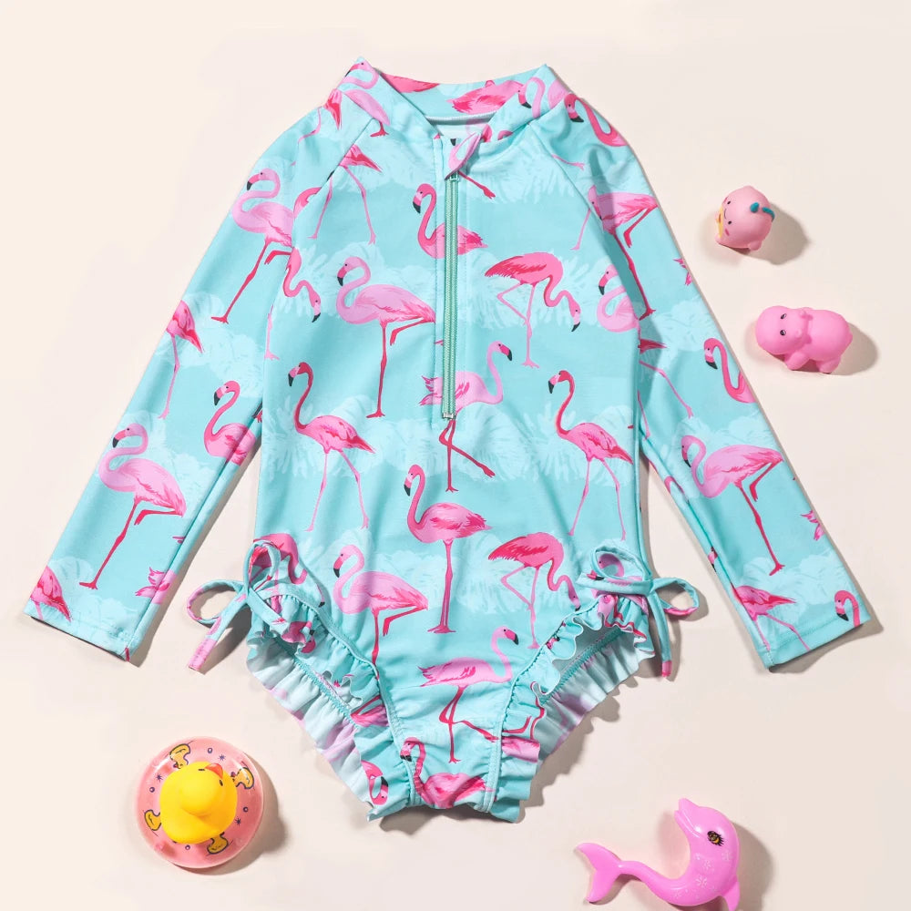 Girls Flamingo UV one-piece swimsuit with long sleeves featuring colorful flamingo print, designed for sun protection and swimming.