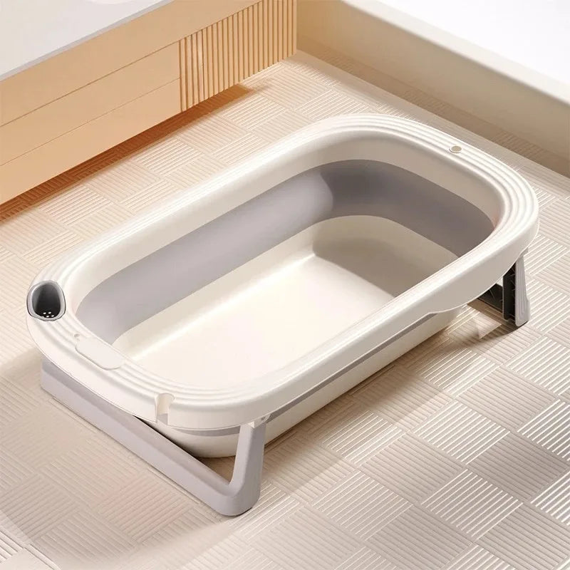 Foldable Baby Bath Tub with temperature sensor by Baby Bubble, showing the compact design and built-in temperature indicator.