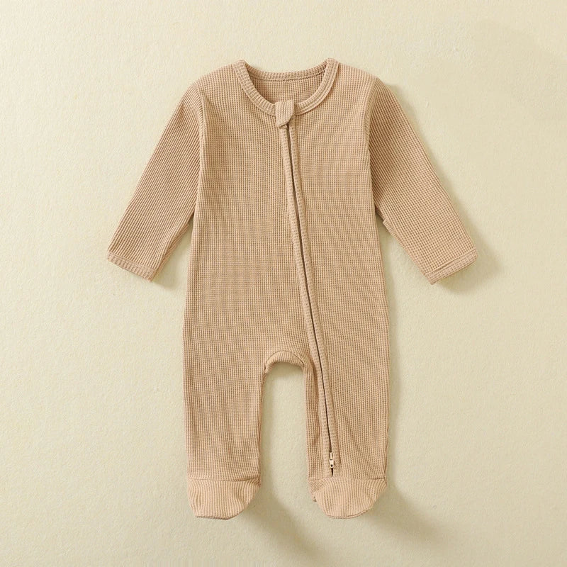 Baby Bubble organic cotton baby romper with waffle texture, long sleeves, zipper closure, footed design, suitable for boys and girls.