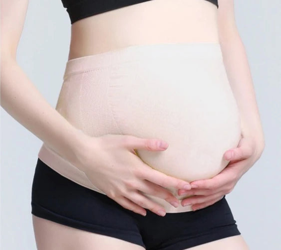 Pregnant woman wearing Baby Bubble prenatal belly brace belt providing breathable support for 2-10 months of pregnancy.