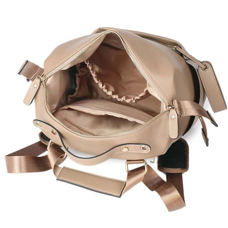 Large leather diaper bag backpack by Baby Bubble, stylish and spacious for carrying baby essentials comfortably.