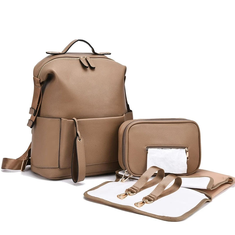 Large leather diaper bag backpack by Baby Bubble, stylish and spacious with multiple compartments for baby essentials.