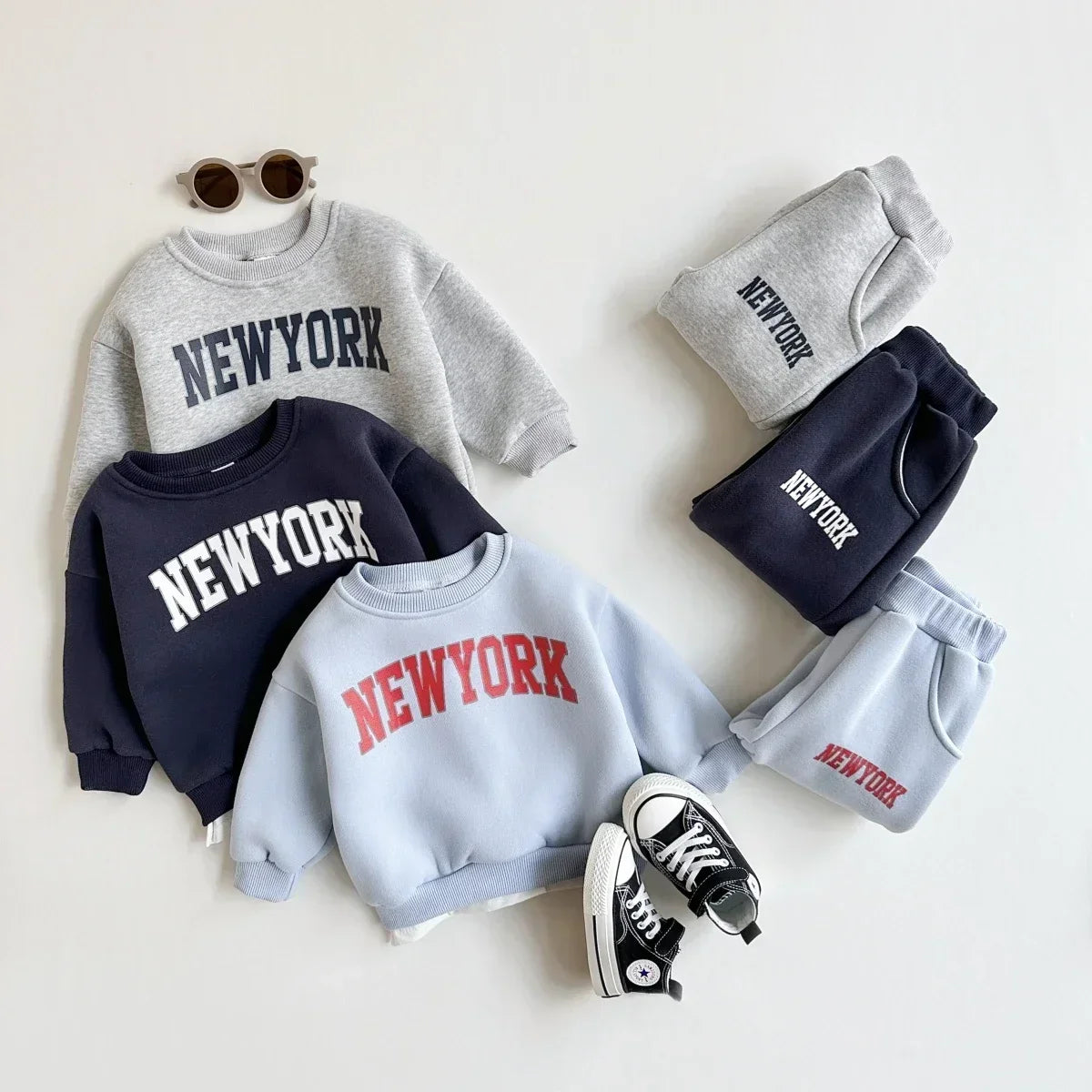 Baby Bubble baby winter outfit with a New York print top and matching pants, cozy 2-piece set for infants.