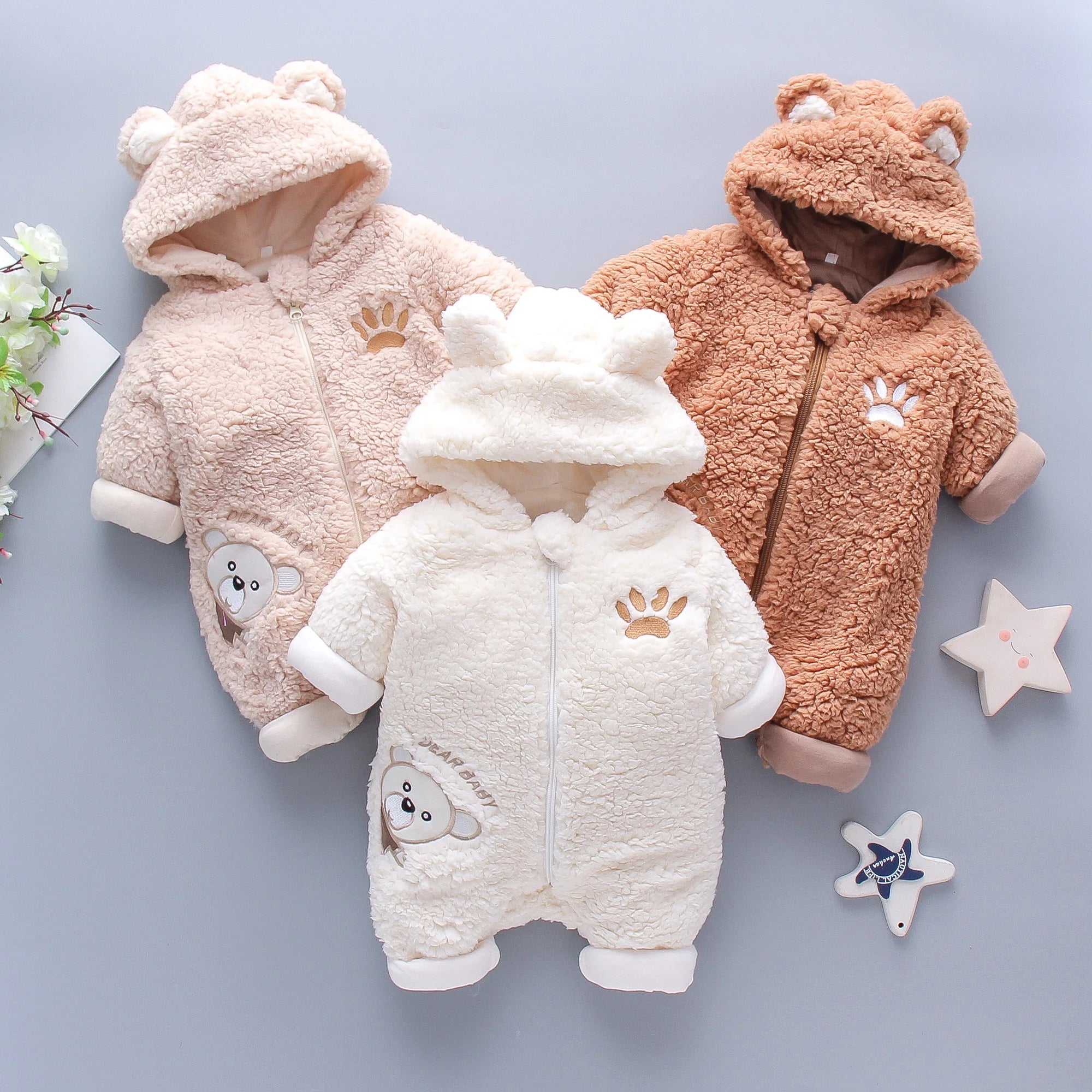 Soft fluffy lamb baby romper in warm winter jumpsuit style, featuring cozy fabric and adorable lamb design for infants.