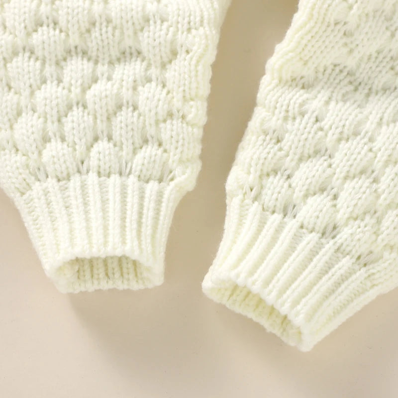Baby Bubble knitted romper and cap set in cozy autumn/winter style, featuring soft, warm knit fabric for comfort.