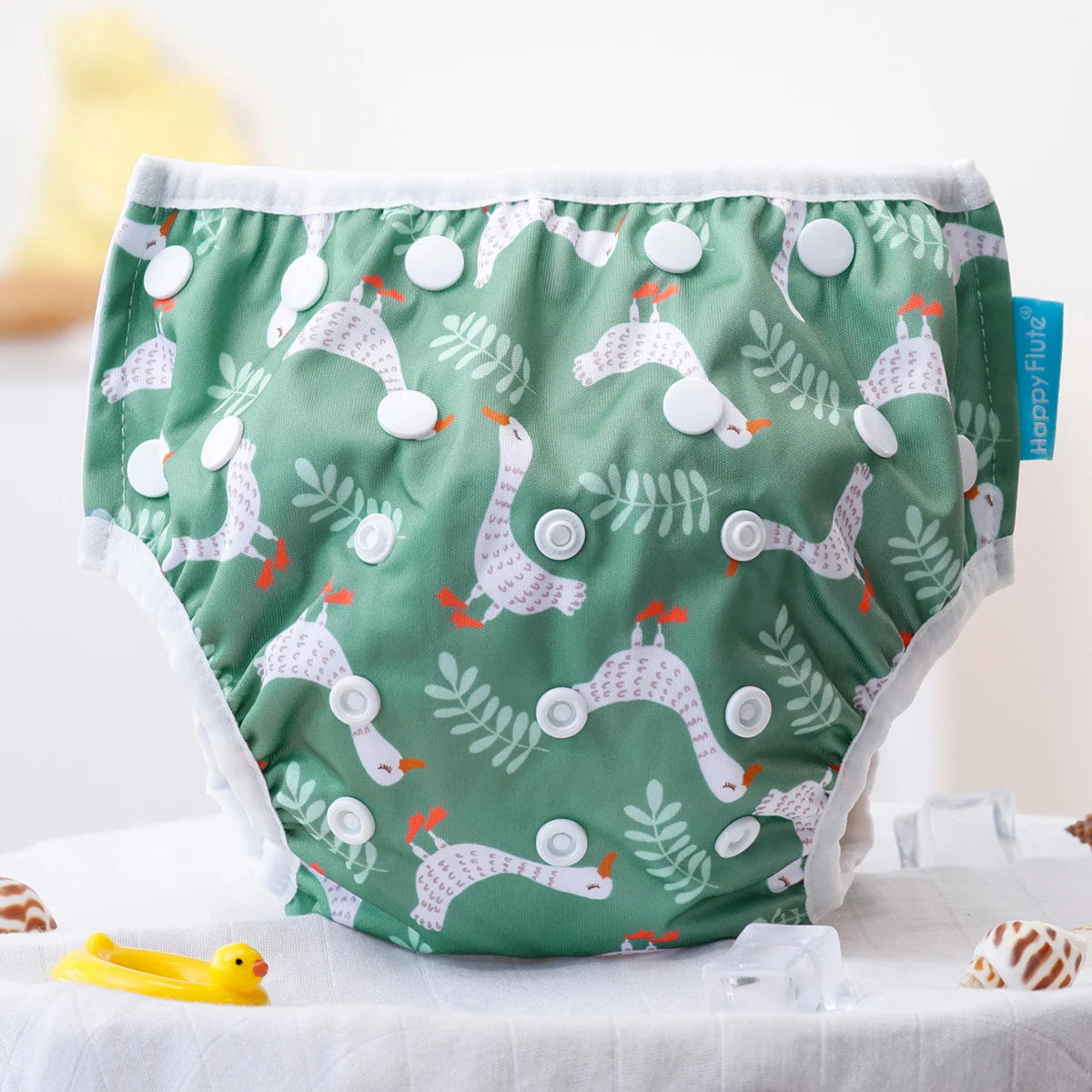 Reusable baby swim diapers with colorful animal print from Baby Bubble, designed for comfortable water play and quick drying.