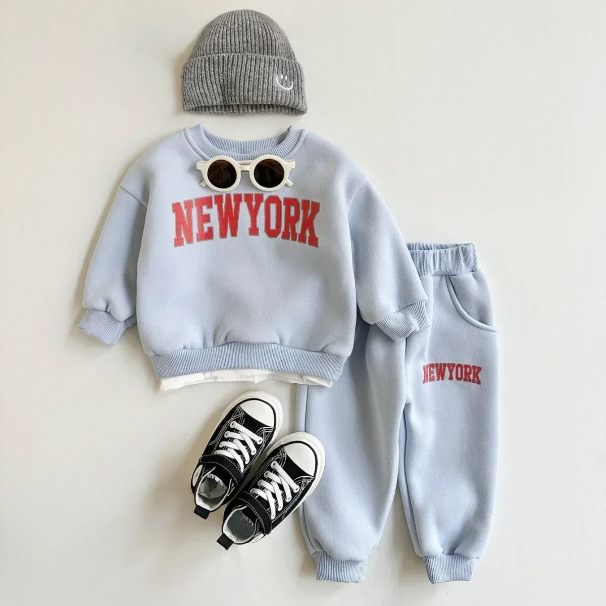 Baby Bubble winter baby 2-piece set with New York print top and matching pants, soft and cozy for cold weather.