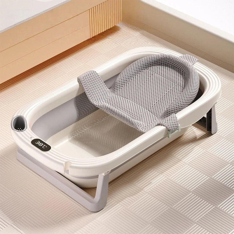 Foldable Baby Bath Tub with temperature sensor from Baby Bubble, showing soft, foldable design and built-in temperature indicator.