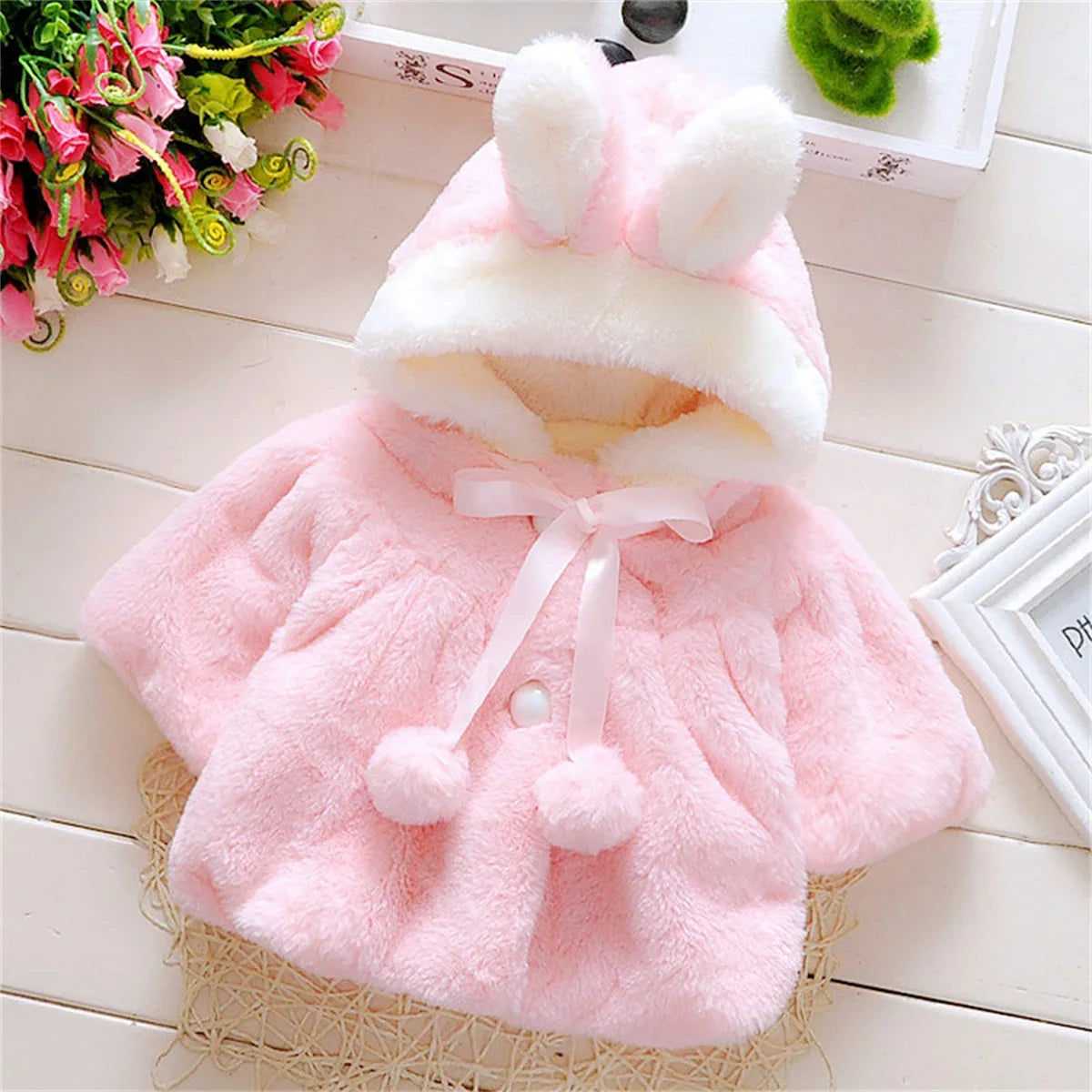 Children's wool cape and fleece jacket by Baby Bubble, featuring cozy wool material and ear fleece details for warmth.