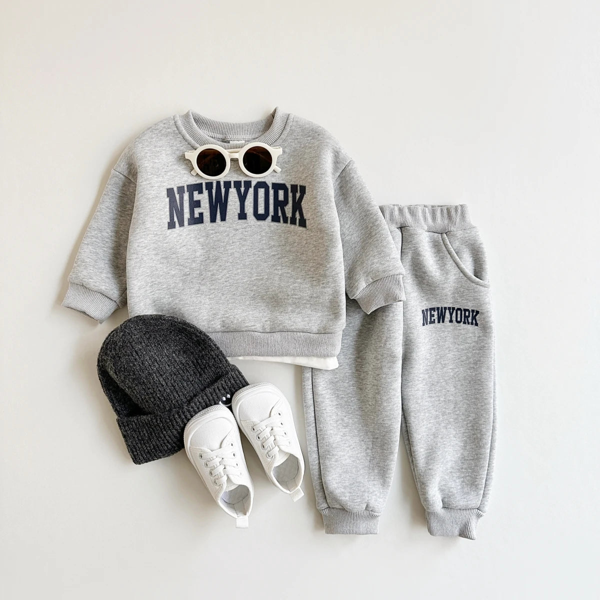 Baby Bubble winter baby 2-piece set with New York print top and matching pants, suitable for cold weather.