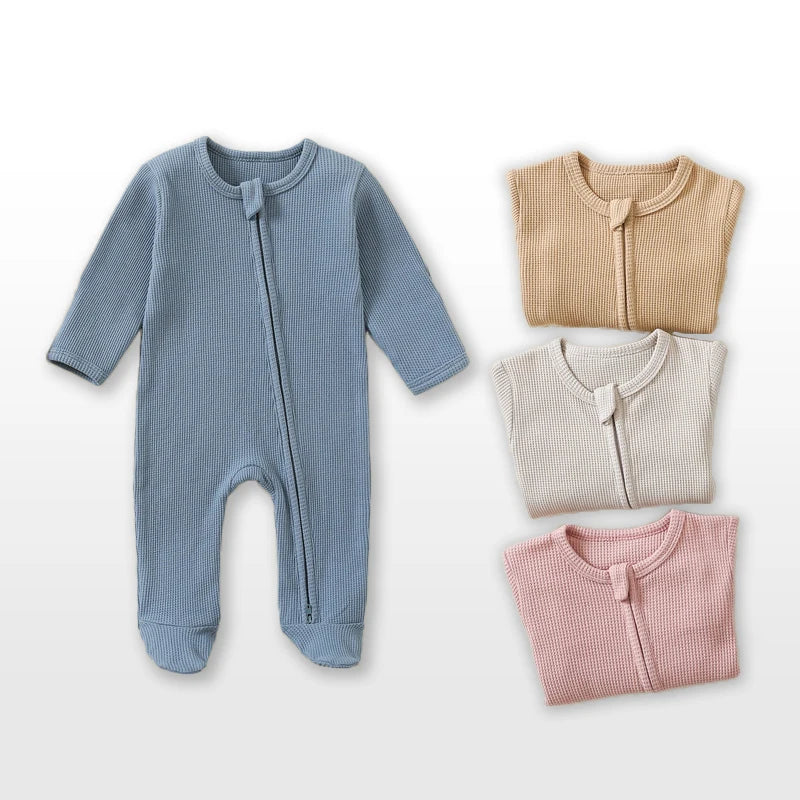 Baby Bubble organic cotton baby romper in waffle knit, long-sleeve, footed jumpsuit with zipper, suitable for infant boys and girls.