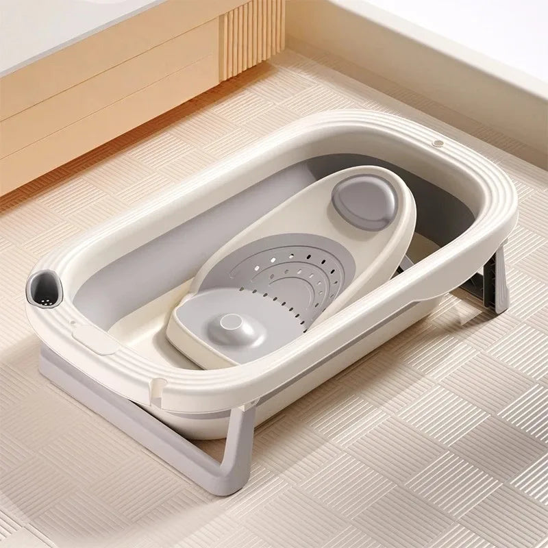 Foldable Baby Bath Tub with temperature sensor by Baby Bubble, showing a compact, foldable design with digital temperature display.