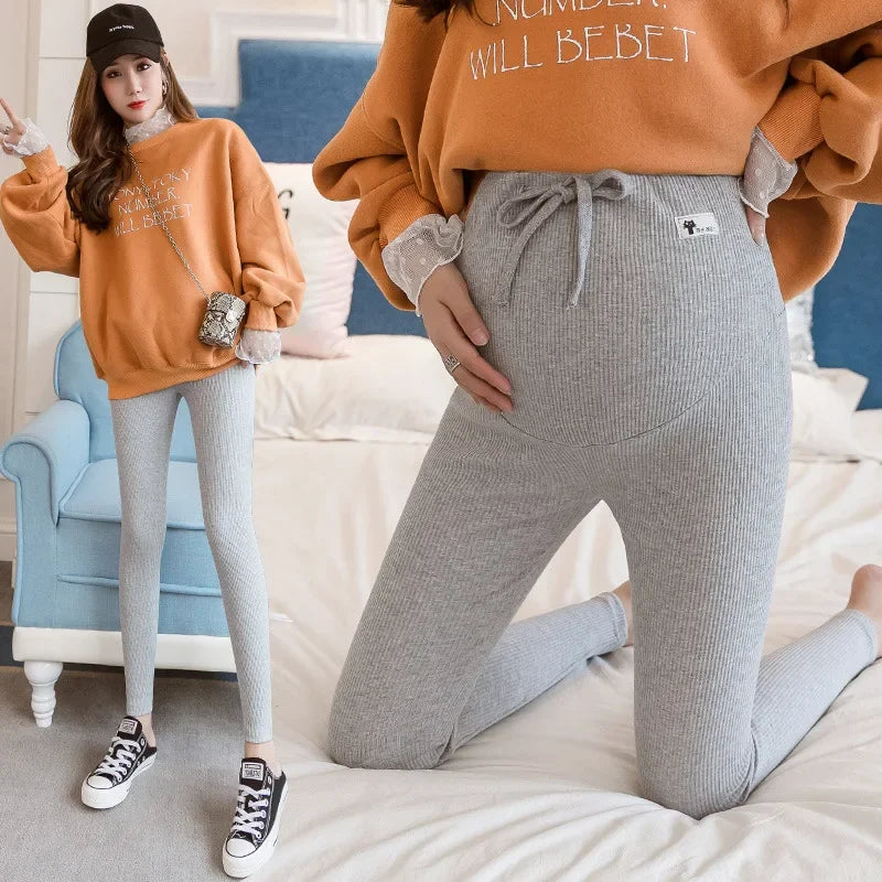 Adjustable maternity pants from Baby Bubble featuring soft high waist design for comfortable pregnancy wear.