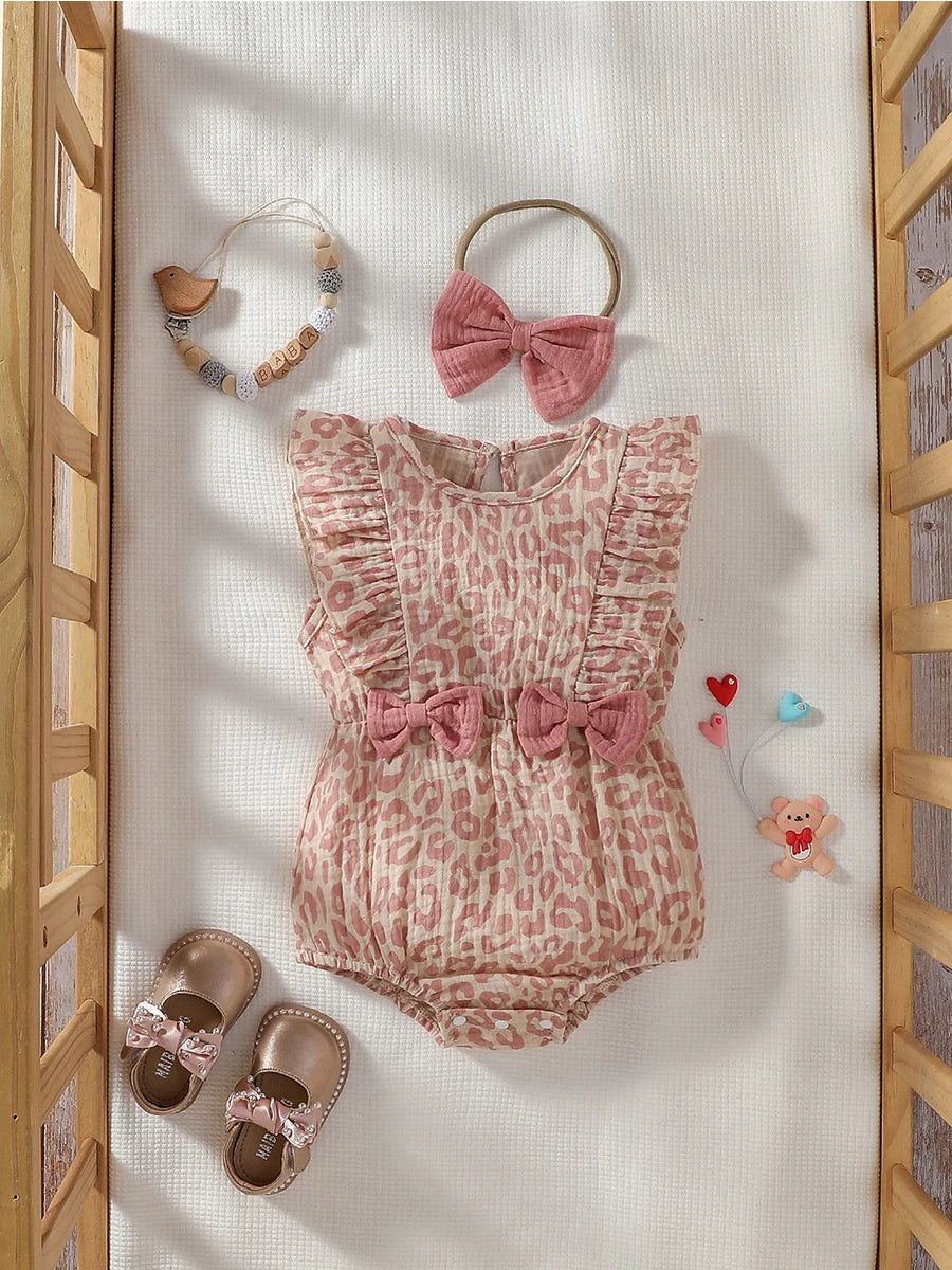 Baby Girl summer pink jumpsuit with bow detail, paired with matching headband, from Baby Bubble, perfect for warm weather.