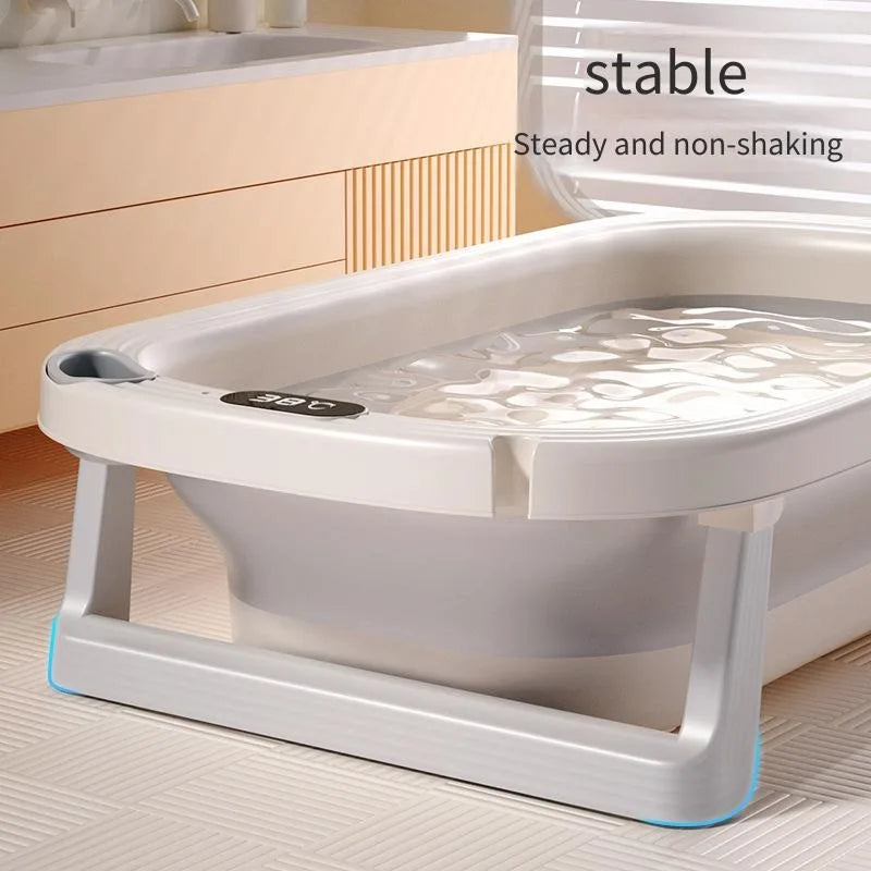 Foldable Baby Bath Tub with built-in temperature sensor by Baby Bubble, showing the compact design and soft interior for safe bathing.