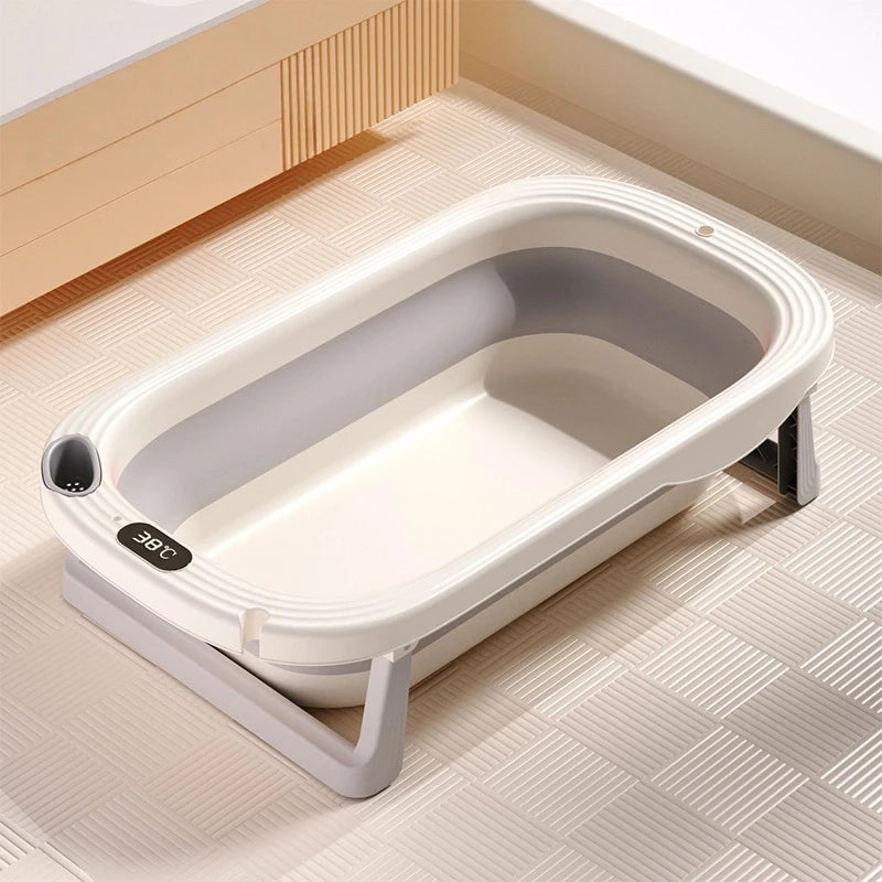 Foldable Baby Bath Tub with temperature sensor from Baby Bubble, showing the compact, foldable design and built-in temperature indicator.